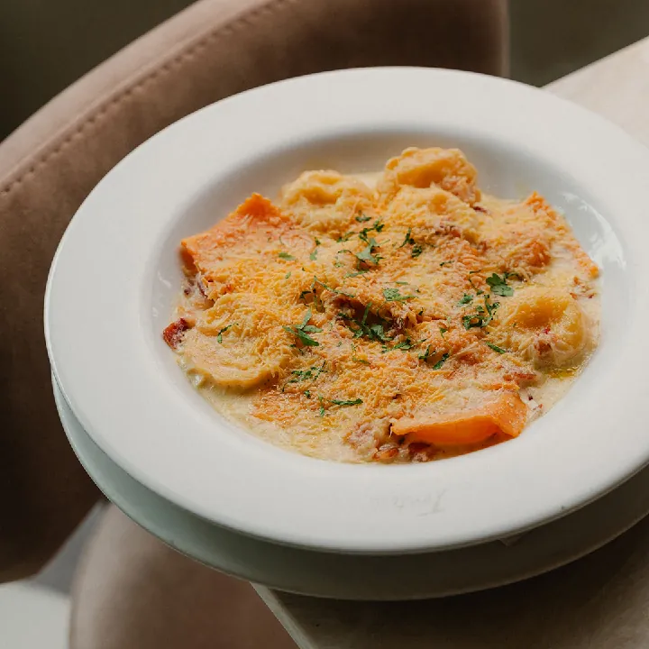 Corn and plantain ravioli in carbonara sauce